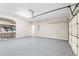 Spacious two car garage with epoxy floor and storage shelves at 1310 Scenic View Trce, Lawrenceville, GA 30044