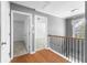 Upstairs hallway with hardwood floors leading to a bedroom at 1310 Scenic View Trce, Lawrenceville, GA 30044
