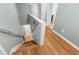 Hallway view from above featuring hardwood floors and staircase leading to multiple rooms with white trim at 1310 Scenic View Trce, Lawrenceville, GA 30044