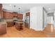 Kitchen with granite countertops, stainless appliances, island with shelving, and hardwood floors at 1310 Scenic View Trce, Lawrenceville, GA 30044