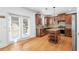 Kitchen featuring granite countertops, stainless appliances, an island, and access to the patio at 1310 Scenic View Trce, Lawrenceville, GA 30044