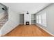 Living room with hardwood floors, decorative fireplace and large windows at 1310 Scenic View Trce, Lawrenceville, GA 30044