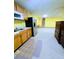 Finished basement kitchenette with wood cabinets, stainless steel appliances and carpet at 4503 Hunters Ter, Stone Mountain, GA 30083