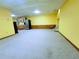 Finished basement featuring carpeted floors, painted walls, and potential kitchenette area at 4503 Hunters Ter, Stone Mountain, GA 30083
