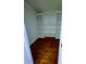Organized walk-in closet with built-in shelves and wood flooring, providing ample storage space at 4503 Hunters Ter, Stone Mountain, GA 30083