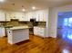 Modern kitchen with white cabinets, granite countertops, stainless steel appliances, and hardwood flooring at 4503 Hunters Ter, Stone Mountain, GA 30083