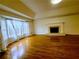 Spacious living room with hardwood floors, large bay window, fireplace, and a vaulted ceiling at 4503 Hunters Ter, Stone Mountain, GA 30083