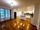 Open-concept living area with hardwood floors, recessed lighting, and a view into the kitchen at 4503 Hunters Ter, Stone Mountain, GA 30083