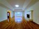 Open-concept living room showcasing hardwood floors, fireplace, and a large bay window with lots of light at 4503 Hunters Ter, Stone Mountain, GA 30083