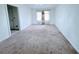 Neutral living room featuring plush carpeting and plenty of natural light at 4503 Hunters Ter, Stone Mountain, GA 30083