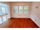 Bright living room featuring hardwood floors and large windows offering natural light at 4503 Hunters Ter, Stone Mountain, GA 30083