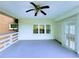 Spacious covered porch with wooden deck and a ceiling fan, perfect for outdoor living at 4503 Hunters Ter, Stone Mountain, GA 30083