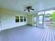 Covered porch with a ceiling fan, wooden deck, and access to the backyard at 4503 Hunters Ter, Stone Mountain, GA 30083