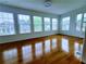 Sunroom with multiple windows and hardwood floors at 4503 Hunters Ter, Stone Mountain, GA 30083