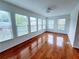 Sunroom with natural light and multiple windows, offering a relaxing space to enjoy views of the outdoors at 4503 Hunters Ter, Stone Mountain, GA 30083
