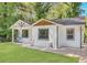 Charming single-story home boasts a well-manicured lawn and delightful curb appeal with detailed trim and an inviting egg chair at 1497 Eason Nw St, Atlanta, GA 30314