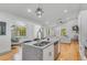 Modern kitchen with granite countertops, stainless steel appliances, and an open concept design flowing into the living area at 1497 Eason Nw St, Atlanta, GA 30314