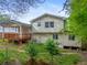 Home backyard with a wooden deck, siding, and grass lawn at 2100 Rockies Ct, Norcross, GA 30071
