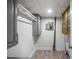 Basement space featuring gray cabinets, laminate wood-look flooring, and utility panel at 2100 Rockies Ct, Norcross, GA 30071