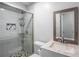 Modern bathroom features a glass-enclosed shower, vanity, and updated fixtures at 2100 Rockies Ct, Norcross, GA 30071