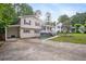 Charming home with a covered front porch, landscaped yard, and a carport at 2100 Rockies Ct, Norcross, GA 30071