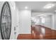The foyer opens to the living space featuring white walls and hardwood floors at 2100 Rockies Ct, Norcross, GA 30071