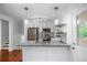 Modern kitchen with stainless steel appliances, gray countertops, and stylish pendant lighting at 2100 Rockies Ct, Norcross, GA 30071