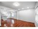 Bright living room featuring hardwood floors, recessed lighting, and a seamless transition to the kitchen area at 2100 Rockies Ct, Norcross, GA 30071