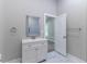 Bathroom with modern vanity and tile work, leading to the bedroom at 3017 Tribble Ln, Atlanta, GA 30311