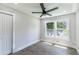 Cozy bedroom featuring new floors, two windows allowing ample natural light, and closet for optimal storage at 3017 Tribble Ln, Atlanta, GA 30311