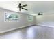Spacious living room with ceiling fans and large windows offering natural light at 3017 Tribble Ln, Atlanta, GA 30311