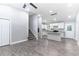 Bright living room with modern gray walls, hardwood floors, a stylish ceiling fan, and an open layout to the kitchen at 3017 Tribble Ln, Atlanta, GA 30311