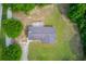 Aerial shot of home and deck with roof top, landscaped yard, and surrounding trees at 3600 Anglin Rd, Loganville, GA 30052