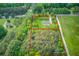 Aerial view with lot lines showing the land's borders, home, and wooded areas at 3600 Anglin Rd, Loganville, GA 30052