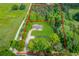 Aerial view of a property with approximate lot lines, home, and surrounding greenery at 3600 Anglin Rd, Loganville, GA 30052