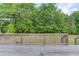 Lovely wooden deck overlooking lush green trees in a relaxing outdoor space at 3600 Anglin Rd, Loganville, GA 30052