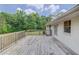 Expansive wooden deck adjacent to a painted brick home, perfect for entertaining at 3600 Anglin Rd, Loganville, GA 30052