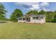 Exterior view of a one-story brick home with a well-manicured front lawn at 3600 Anglin Rd, Loganville, GA 30052
