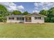 Charming brick home featuring a well-maintained lawn and inviting front porch at 3600 Anglin Rd, Loganville, GA 30052