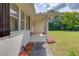 A cozy front porch with flower pots that add to the home's curb appeal at 3600 Anglin Rd, Loganville, GA 30052