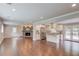 Spacious living room with dark hardwood floors, and a brick fireplace at 3600 Anglin Rd, Loganville, GA 30052