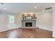 Cozy living room features a stylish fireplace, hardwood floors and plenty of natural light at 3600 Anglin Rd, Loganville, GA 30052