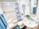 Stylish bathroom with white fixtures, walk-in shower, and decor accents at 4180 Mount Paran Dr, Social Circle, GA 30025