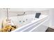 Elegant white bathtub with jets, perfect for relaxing and unwinding at 4180 Mount Paran Dr, Social Circle, GA 30025