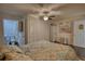 Comfortable bedroom features a ceiling fan and en-suite bathroom access; the room is brightly lit at 4180 Mount Paran Dr, Social Circle, GA 30025