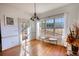 Sunlit breakfast nook with hardwood floors and a view of the backyard, creating a cheerful and inviting space at 4180 Mount Paran Dr, Social Circle, GA 30025