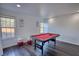 Well-lit game room with pool table and comfortable seating, perfect for entertaining at 4180 Mount Paran Dr, Social Circle, GA 30025