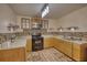 Well-equipped kitchen with wooden cabinets, modern appliances, and designer backsplash; great for cooking at 4180 Mount Paran Dr, Social Circle, GA 30025