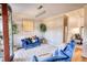 Cozy sitting area with plush blue seating, decorative plants, and a stylish chandelier, perfect for intimate gatherings at 4180 Mount Paran Dr, Social Circle, GA 30025