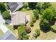 Aerial view of the property showing the backyard, patio, and surrounding landscaping and homes at 45 Waterloo Ct, Hiram, GA 30141